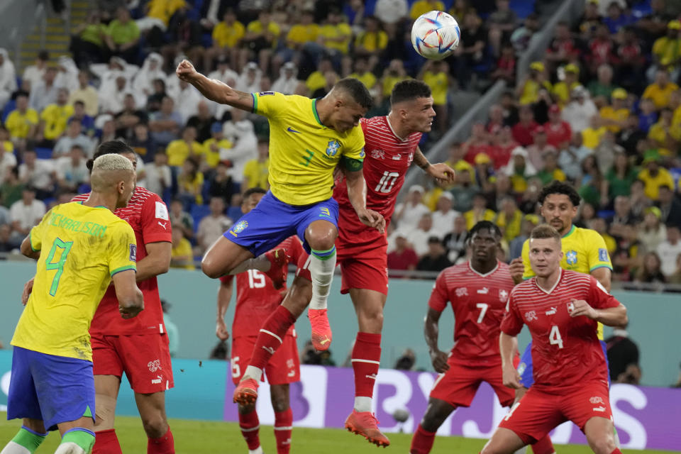 Brazil's Thiago Silva, left, and Switzerland's Granit Xhaka challenge for the ball during the World Cup group G soccer match between Brazil and Switzerland, at the Stadium 974 in Doha, Qatar, Monday, Nov. 28, 2022. (AP Photo/Natacha Pisarenko)