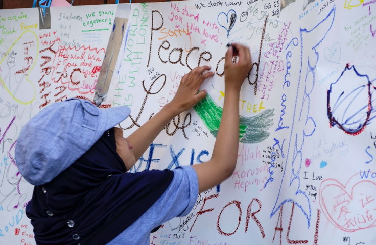 Tributes have been paid to the victims of the attack at the scene (Rex)