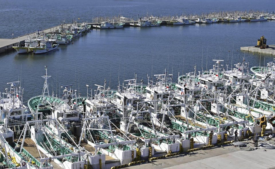 Fishing boats line up at a port in Soma, Fukushima prefecture, Japan Tuesday, Aug. 22, 2023. Japan will start releasing treated and diluted radioactive wastewater from the Fukushima Daiichi nuclear plant into the Pacific Ocean as early as Thursday, a controversial but essential early step in the decades of work to shut down the facility 12 years after its meltdown disaster. (Kyodo News via AP)