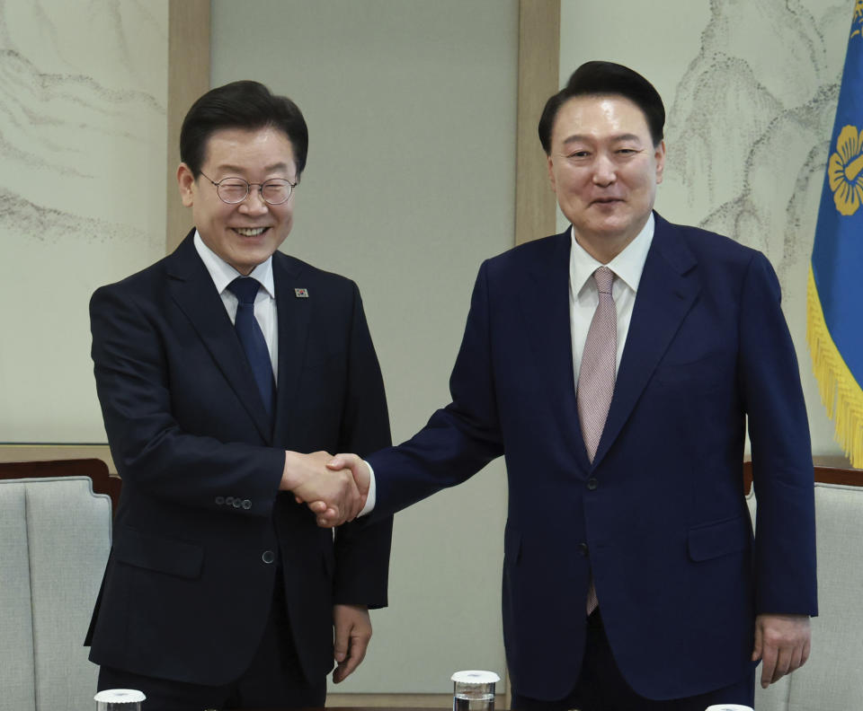 South Korean President Yoon Suk Yeol, right, shakes hands with main opposition Democratic Party leader Lee Jae-myung during a meeting at the presidential office in Seoul South Korea, Monday, April 29, 2024. (Hong Hae-in/Yonhap via AP)