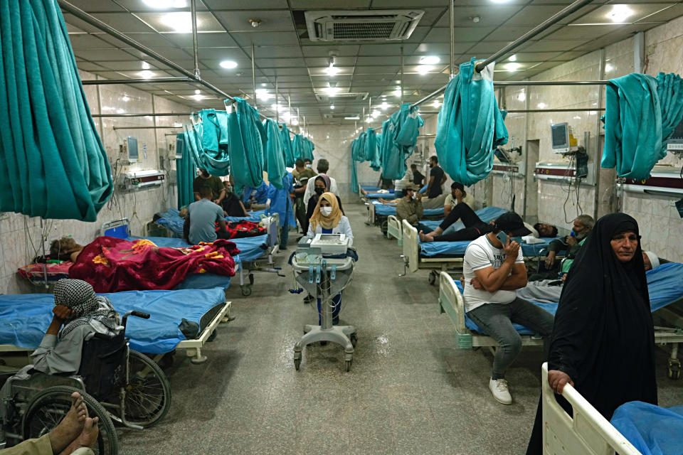 People with breathing problems are treated at a hospital during a sandstorm in Baghdad, Iraq, Monday, May 16, 2022. (AP Photo/Hadi Mizban)