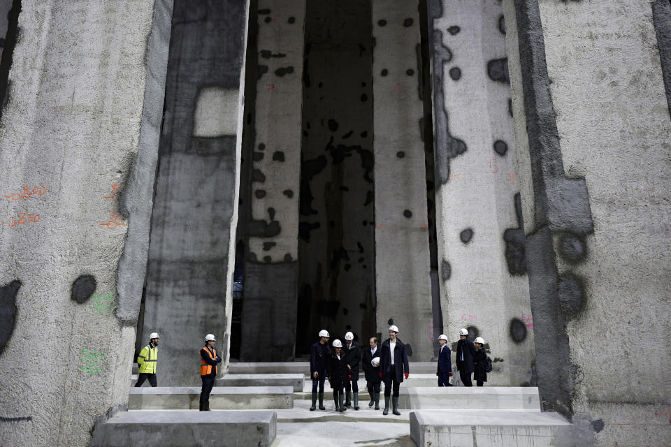 Paris' mayor Anne Hidalgo and other officials attend the inauguration of the Austerlitz wastewater and rainwater storage basin, which is intended to make the Seine river swimmable during the Paris 2024 Olympic Games, in Paris, Thursday, May 2, 2024. The works underground next to Paris' Austerlitz train station are part of a 1.5 billion euro effort to clean up the Seine so it can host marathon swimming and triathlon events at the July 26-Aug 11 Summer Games and be opened to the general public for swimming from 2025. (Stephane de Sakutin, Pool via AP)