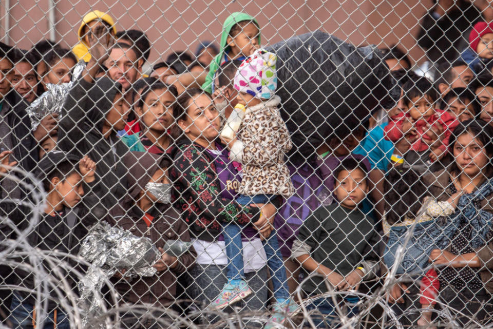 Migrants are gathered inside the fence of a makeshift detention center in El Paso, Texas on Wed. March 27, 2019. | Sergio Flores—The Washington Post/Getty Images