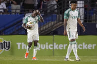 Austin FC forward Jáder Obrian, left, and defender Julio Cascante, right, react after giving up a goal to FC Dallas forward Jesus Ferreira during the second half of an MLS soccer match Saturday, May 11, 2024, in Frisco, Texas. (AP Photo/LM Otero)