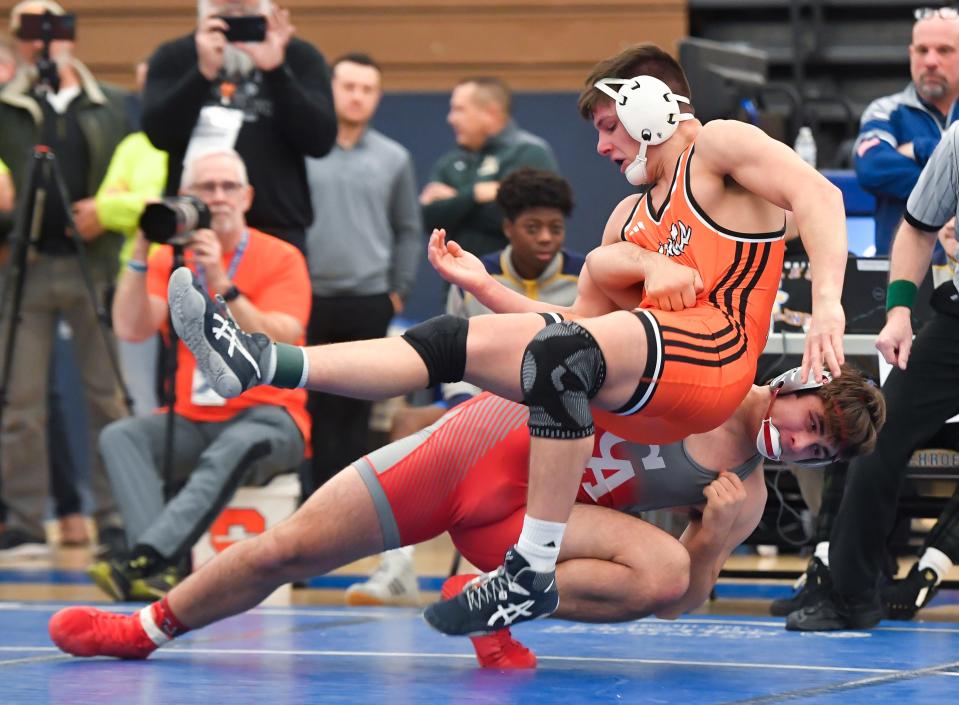 Churchville-Chili’s Coy Raines, top, wrestles Canandaigua’s Mason Depew in the final of the 215-pound weight class during the Monroe County Wrestling Championships, Saturday, Dec. 16, 2023.