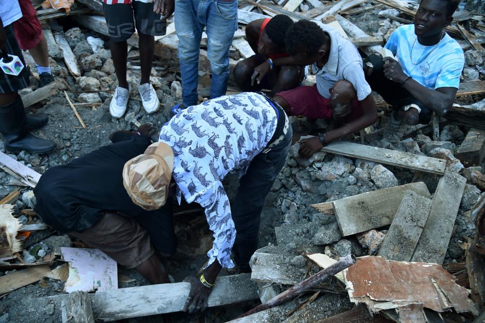 Haitians look for food on Oct. 8, 2016.