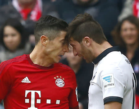 Football Soccer - Bayern Munich v Eintracht Frankfurt - German Bundesliga - Allianz-Arena, Munich, Germany - 02/04/16 Eintracht Frankfurt's David Abraham and Bayern Munich's Robert Lewandowski in action. REUTERS/Michael Dalder.