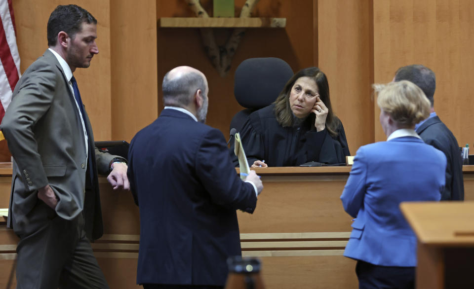 Judge Amy Messer, center, Assistant New Hampshire Attorney General Christopher Knowles, left, Senior Assistant New Hampshire Attorney General Benjamin Agati, second from left, defense attorneys Caroline Smith, second from right, and James Brooks confer before proceedings in Adam Montgomery's trial, Wednesday, Feb. 21, 2024, in Manchester, N.H. Montgomery is accused of killing his 5-year-old daughter. (Jim Davis/The Boston Globe via AP, Pool)