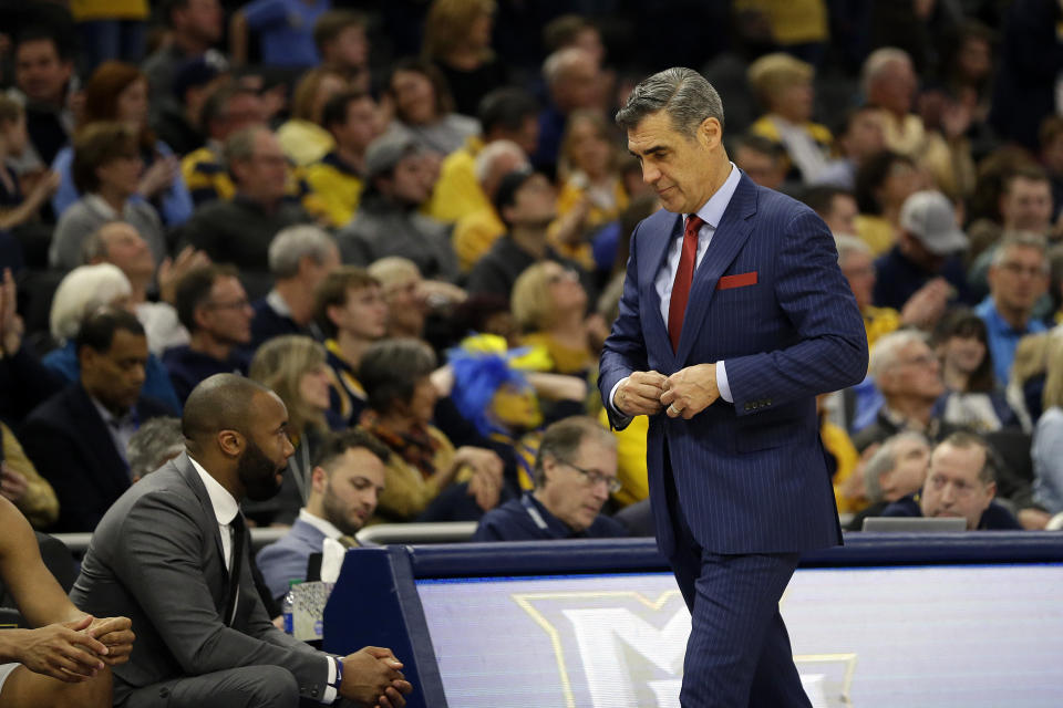 Villanova head coach Jay Wright buttons his suit jacket during the second half of an NCAA college basketball game against Marquette, Saturday, Jan. 4, 2020, in Milwaukee. (AP Photo/Aaron Gash)