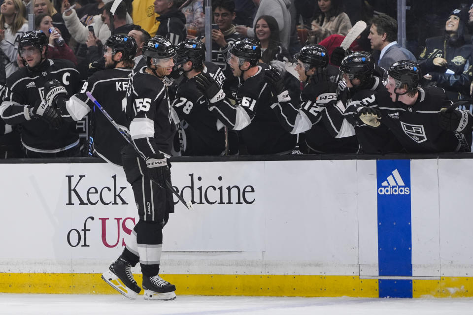 Los Angeles Kings right wing Quinton Byfield is congratulated for his goal against the Columbus Blue Jackets during the first period of an NHL hockey game Tuesday, Feb. 20, 2024, in Los Angeles. (AP Photo/Ryan Sun)