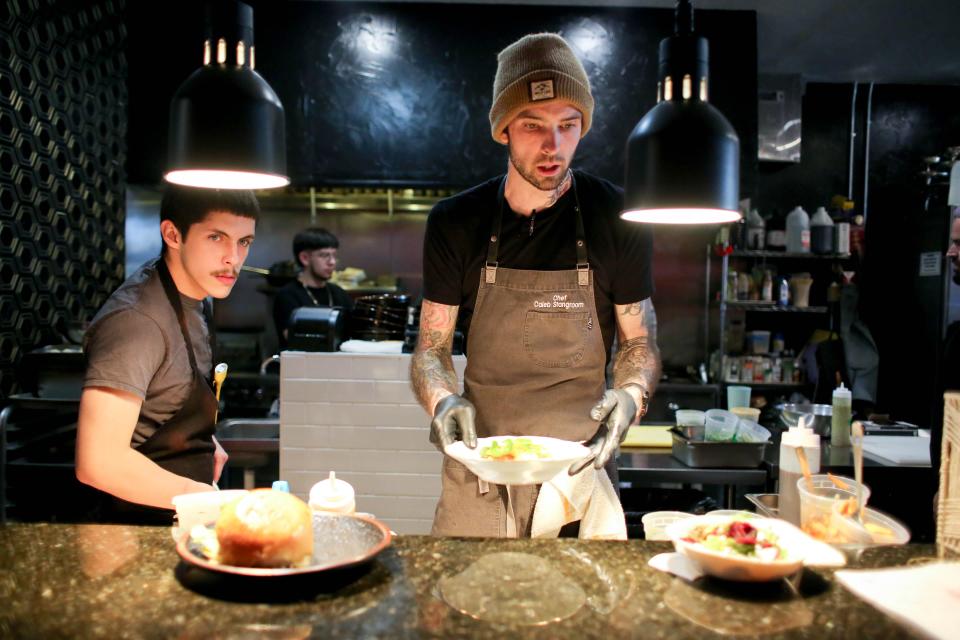 Chef Caleb Stangroom prepares orders during a Jan. 31 Tiger Style pop-up at GHST in Oklahoma City.