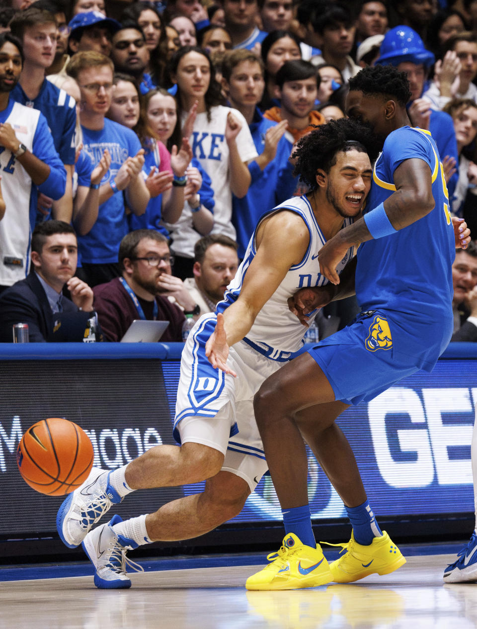 Duke's Jared McCain, left, collides with Pittsburgh's Zack Austin, right, during the first half of an NCAA college basketball game in Durham, N.C., Saturday, Jan. 20, 2024. (AP Photo/Ben McKeown)