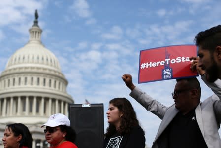 Immigrant rights organizations rally to to call on Congress to create a path to permanent status for TPS holders and DACA recipients at the U.S. Capitol in Washington