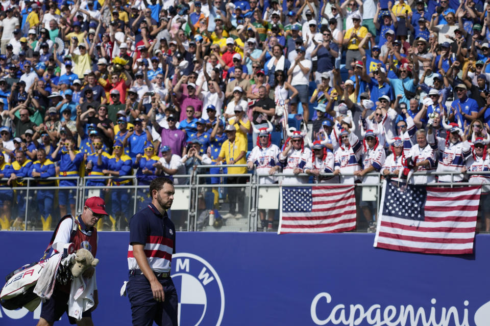 United States' Patrick Cantlay and his caddie Joe LaCava walk off the 1st tee during his singles match at the Ryder Cup golf tournament at the Marco Simone Golf Club in Guidonia Montecelio, Italy, Sunday, Oct. 1, 2023. (AP Photo/Alessandra Tarantino)