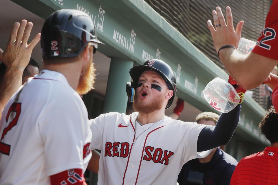 Boston Red Sox's Alex Verdugo, center, celebrates after his two-run home run that also drove in Justin Turner, left, during the first inning of a baseball game against the Oakland Athletics, Saturday, July 8, 2023, in Boston. (AP Photo/Michael Dwyer)