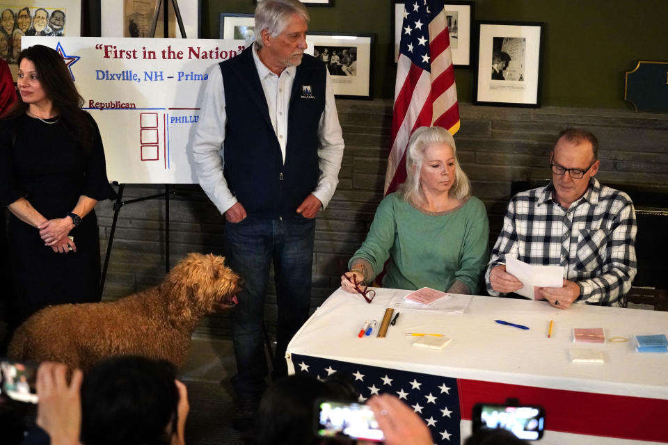 Valerie Maxwell and Scott Maxwell, seated, count the votes shortly after midnight in the presidential primary election, Tuesday, Jan. 23, 2024, in Dixville Notch, N.H. Annmarie Turcotte and Leslie Otten stand at left. All six votes went for Republican presidential candidate and former United Nations Ambassador Nikki Haley. (AP Photo/Robert F. Bukaty)