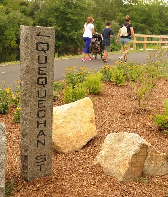 Walkers enjoy the Alfred J. Lima Quequechan River Rail Trail in Fall River.