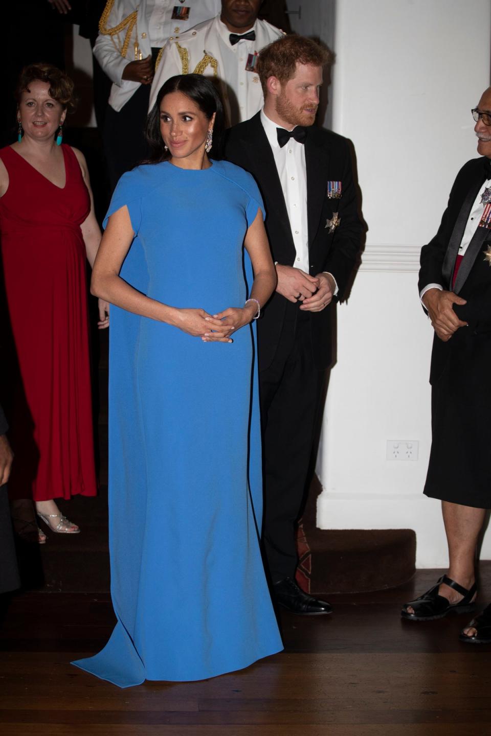 Meghan wore a cape dress. (Getty Images)