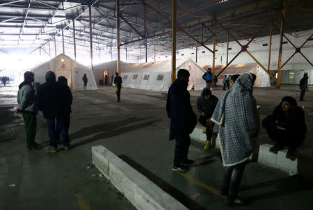 Migrants are seen in a migrant camp in Bihac, Bosnia and Herzegovina, December 14, 2018. REUTERS/Antonio Bronic