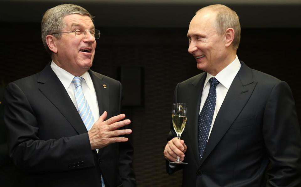 Thomas Bach the President of the International Olympic Committee speaks with Vladimir Putin the President of Russia - IOC president brands critics of Russia ‘deplorable’ in veiled swipe at Britain - Getty Images/Ian Walton