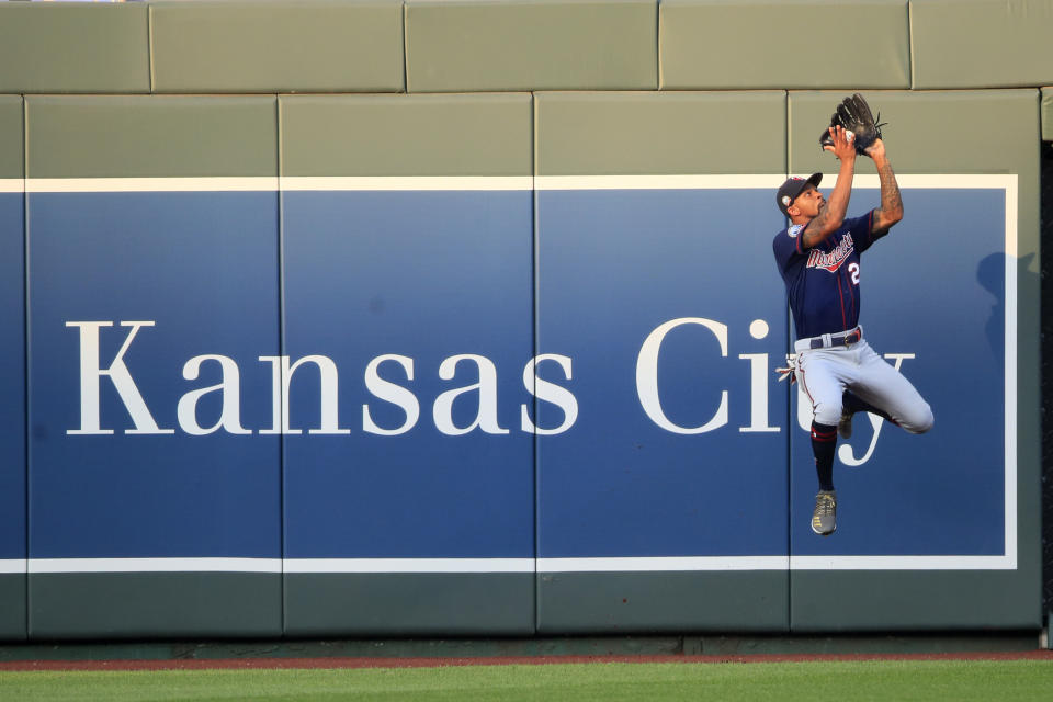 Minnesota Twins center fielder Byron Buxton catches a fly ball hit by Kansas City Royals' Adalberto Mondesi during the third inning of a baseball game at Kauffman Stadium in Kansas City, Mo., Saturday, Aug. 8, 2020. (AP Photo/Orlin Wagner)