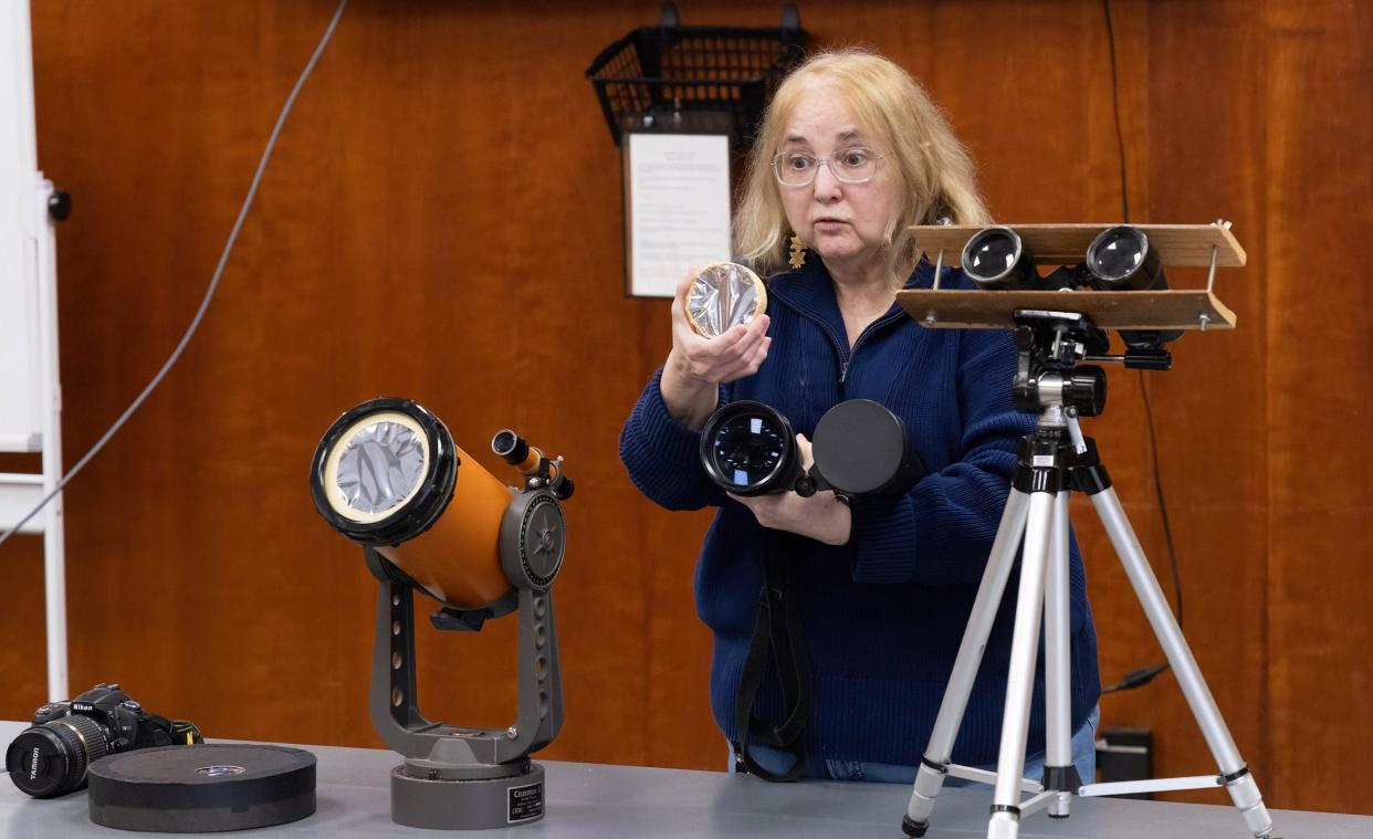 Robin Gill, astronomy education specialist at The Wilderness Center in Sugar Creek Township, conducts a program to teach how to successfully and safely view the solar eclipse.