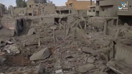 A still image taken from a video released on the internet by Islamic State-affiliated Amaq News Agency, on April 18, 2017, purports to show the aftermath, said to be in al-Bukamal town, in Deir al-Zor province, after air strikes thought to have been directed by planes from a U.S.-led military coalition, Syria. Social Media Website via Reuters TV