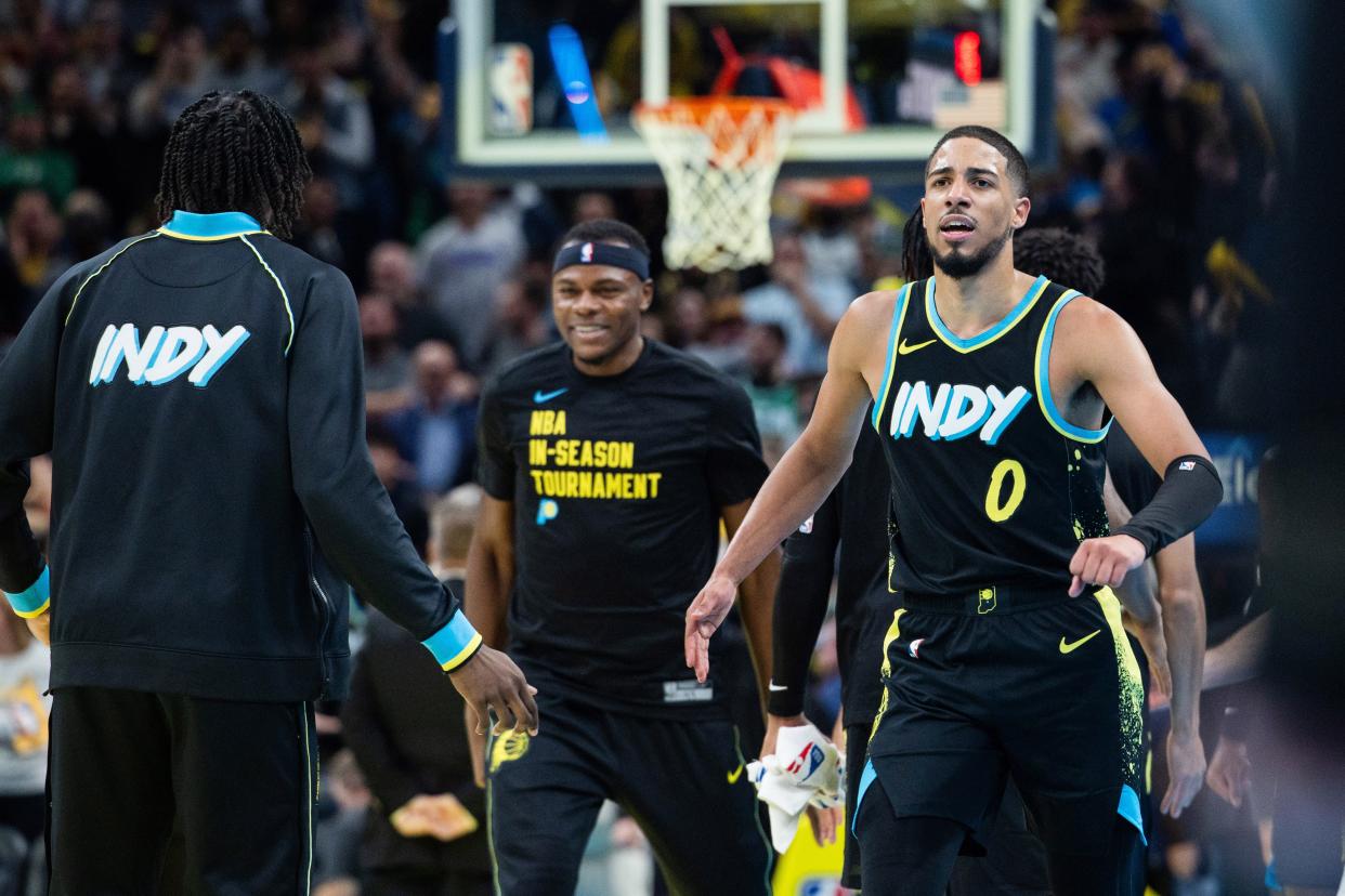 Dec 4, 2023; Indianapolis, Indiana, USA; Indiana Pacers guard Tyrese Haliburton (0) celebrates a made basket in the second half against the Boston Celtics at Gainbridge Fieldhouse. Mandatory Credit: Trevor Ruszkowski-USA TODAY Sports