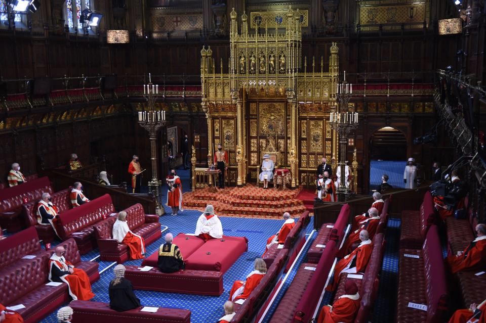 Britain's Queen Elizabeth II reads the Queen's Speech on the The Sovereign's Throne in the House of Lords chamber,, during the State Opening of Parliament at the Houses of Parliament in London on May 11, 2021, which is taking place with a reduced capacity due to Covid-19 restrictions. - The State Opening of Parliament is where Queen Elizabeth II performs her ceremonial duty of informing parliament about the government's agenda for the coming year in a Queen's Speech. (Photo by Eddie MULHOLLAND / POOL / AFP) (Photo by EDDIE MULHOLLAND/POOL/AFP via Getty Images)