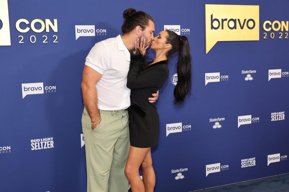 BRAVOCON -- BravoCon 2022 Red Carpet from the Javits Center in New York City on Saturday, October 15, 2022 -- Pictured: (l-r) Brock Davies, Scheana Shay -- (Photo by: Cindy Ord/Bravo via Getty Images)