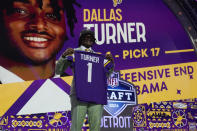 Alabama linebacker Dallas Turner poses being chosen by the Minnesota Vikings with the 17th overall pick during the first round of the NFL football draft, Thursday, April 25, 2024, in Detroit. (AP Photo/Jeff Roberson)