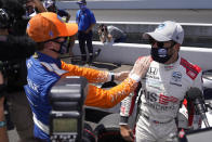 Marco Andretti is congratulated by Scott Dixon, of New Zealand, after Andretti won the pole for the Indianapolis 500 auto race at Indianapolis Motor Speedway, Sunday, Aug. 16, 2020, in Indianapolis. (AP Photo/Darron Cummings)