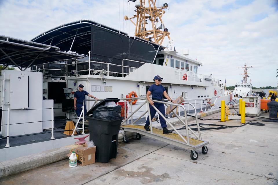 Crew members of the Coast Guard cutter William Flores get ready to go on patrol, Wednesday, Jan. 26, 2022, in Miami Beach, Fla. About 40 people left the island of Bimini in the Bahamas on Saturday evening in what the maritime security agency suspects was a human smuggling operation. One person was found alive off Fort Pierce and one body was recovered. The Coast Guard is searching for the 38 remaining migrants. The William Flores is not part of the operation. (AP Photo/Marta Lavandier)