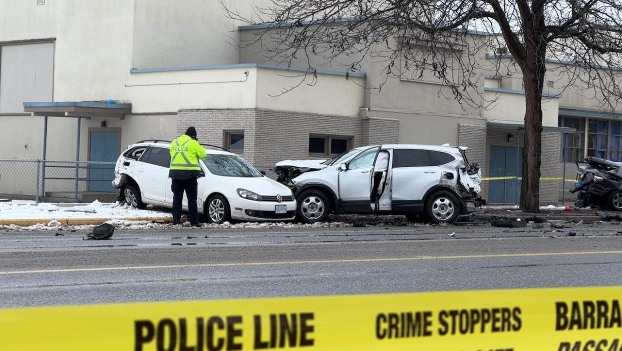 Damaged cars are seen along Rutland Road in Kelowna. (Brady Strachan/CBC - image credit)