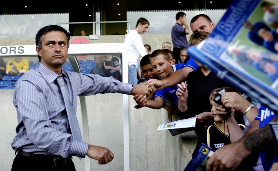 Jose Mourinho signs autographs