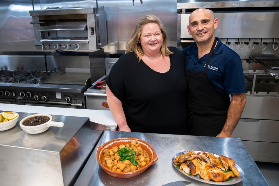 Owners Christie and Steven Moreira pose for a photo in the kitchen area of their York City restaurant, Mesa Moreira, on Thursday, June 29, 2023.