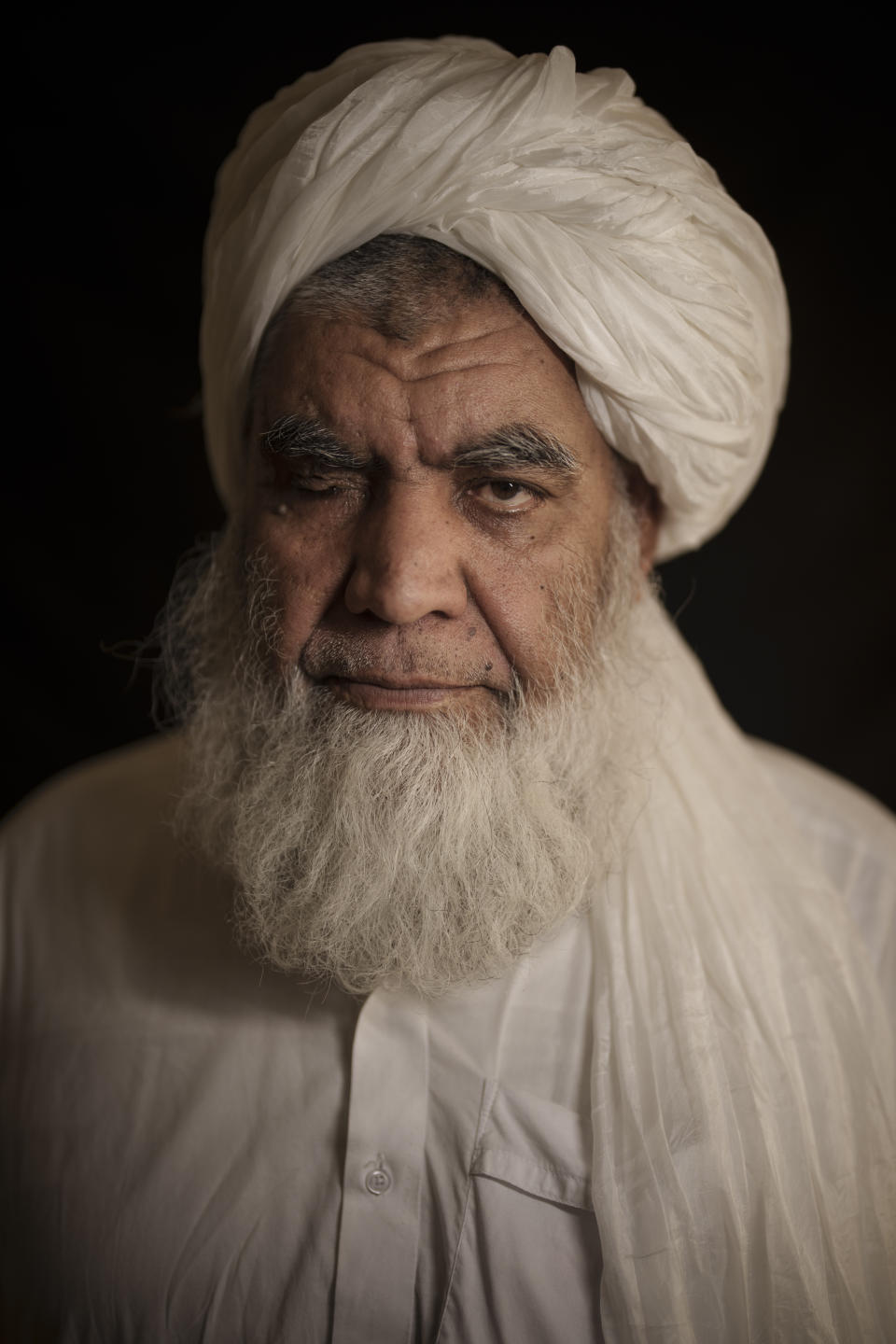 Taliban leader Mullah Nooruddin Turabi poses for a photo in Kabul, Afghanistan, Wednesday, Sept. 22, 2021. Mullah Turabi, one of the founders of the Taliban, says the hard-line movement will once again carry out punishments like executions and amputations of hands, though perhaps not in public. (AP Photo/Felipe Dana)