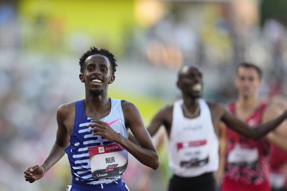 Abdihamid Nur smiles after winning the men's 5000 meters final during the U.S. track and field championships in Eugene, Ore., Sunday, July 9, 2023. (AP Photo/Ashley Landis)