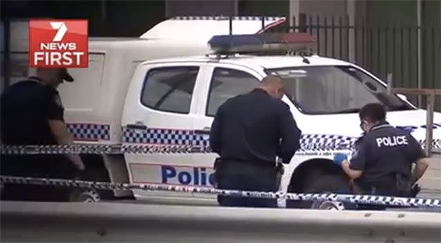 Police at the Logan scene. Picture: 7 News