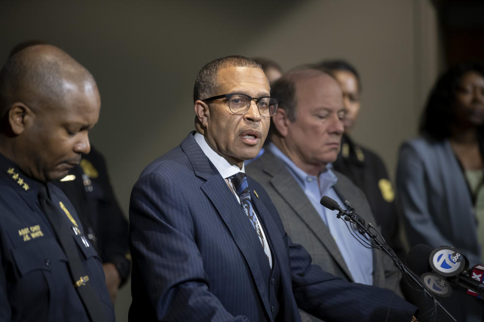 Detroit Police Chief James Craig, second left, speaks to the media at Detroit Public Safety Headquarters, Thursday, November 21, 2019, about two officers who were shot Wednesday evening while responding to a home invasion on Detroit's west side. Officer Rasheen McLain was killed during the incident and another officer was wounded. (David Guralnick/Detroit News via AP)