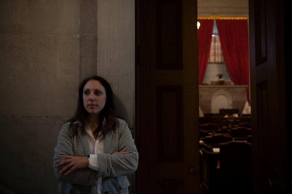 Abby McLean stands in front of the chamber doors to the House of Representatives at the State Capitol building in Nashville, Tenn., Friday, Nov. 17, 2023. McLean, a Covenant School parent, testified during a special session called by Gov. Bill Lee following the Nashville school shooting.