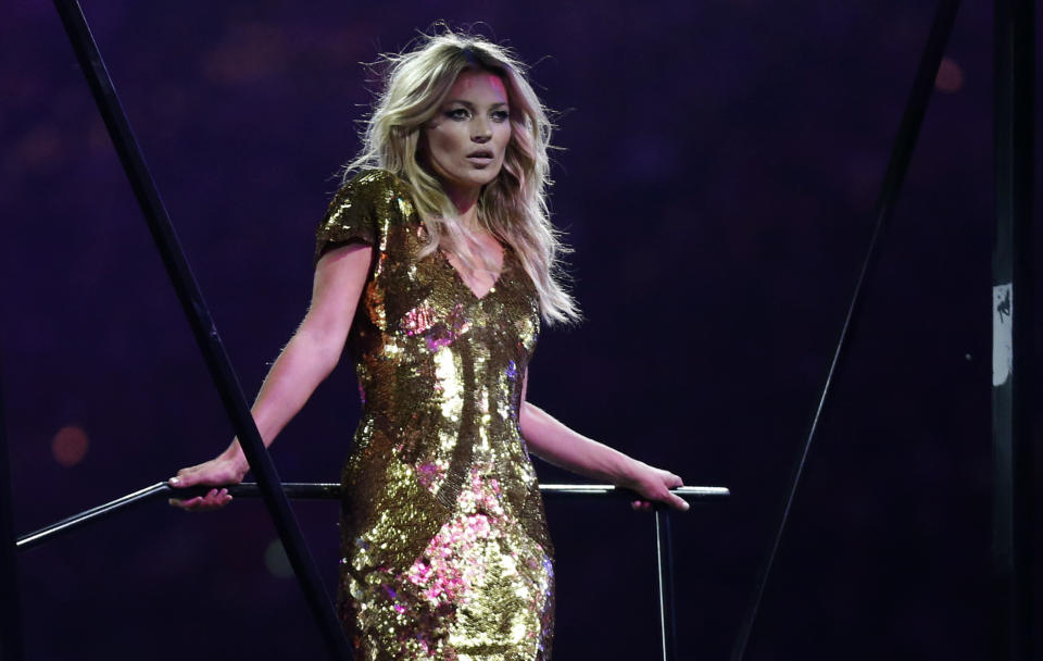 British model Kate Moss poses on stage during the Closing Ceremony at the 2012 Summer Olympics, Sunday, Aug. 12, 2012, in London. (AP Photo/Matt Dunham)