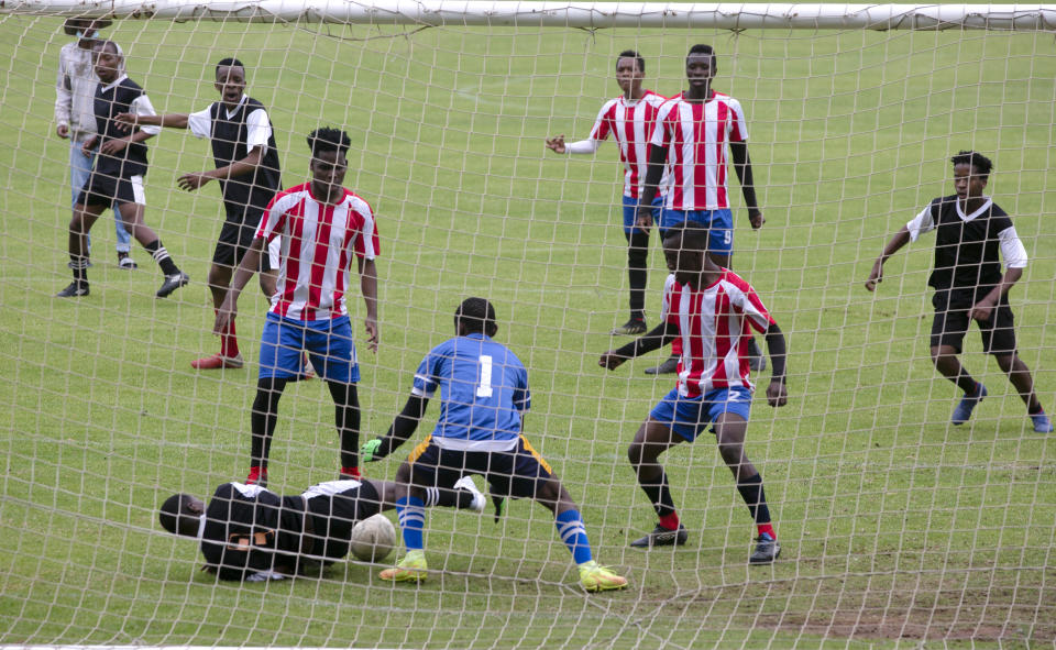 FILE - Students from the Tshwane University of Technology play soccer on campus in Pretoria, South Africa, Saturday, Nov. 27, 2021. The world is racing to contain a new COVID-19 variant, which appears to be driving a surge in South Africa and is casting a pall there. (AP Photo/Denis Farrell, File)