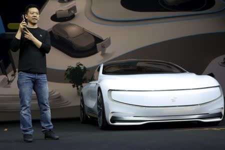 Jia Yueting, co-founder and head of Le Holdings Co Ltd, also known as LeEco and formerly as LeTV, gestures as he unveils an all-electric battery "concept" car called LeSEE during a ceremony in Beijing, China April 20, 2016. REUTERS/Damir Sagolj