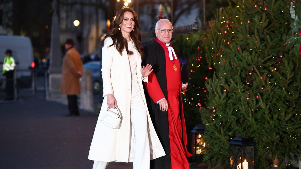 Kate Middleton, wearing cream outfit, waves outside Westminster Abbey