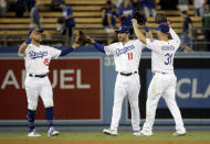 Los Angeles Dodgers' Matt Beaty (45), A.J. Pollock (11) and Joc Pederson (31) celebrate after a 16-3 win over the Toronto Blue Jays during a baseball game Tuesday, Aug. 20, 2019, in Los Angeles. (AP Photo/Marcio Jose Sanchez)