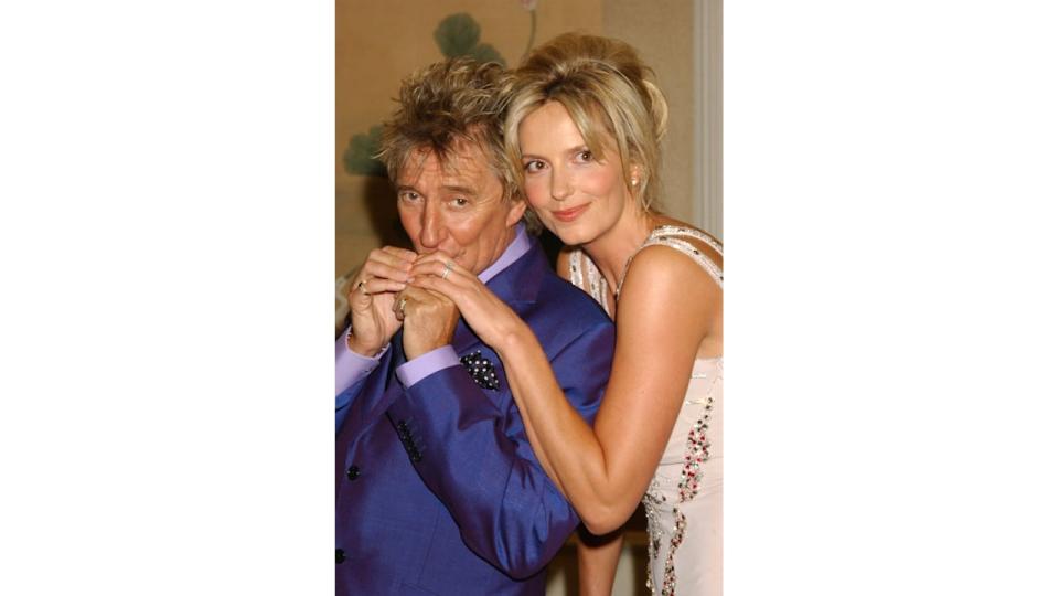 Rod Stewart kissing Penny Lancaster's hand in 2005