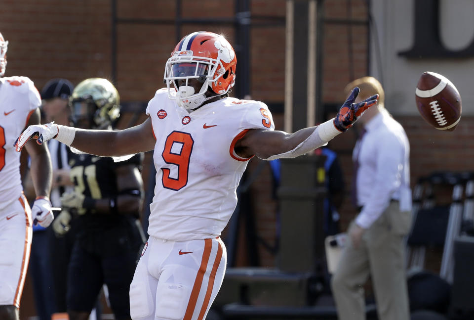 Clemson's Travis Etienne (9) celebrates his touchdown run against Wake Forest during the first half of an NCAA college football game in Charlotte, N.C., Saturday, Oct. 6, 2018. (AP Photo/Chuck Burton)