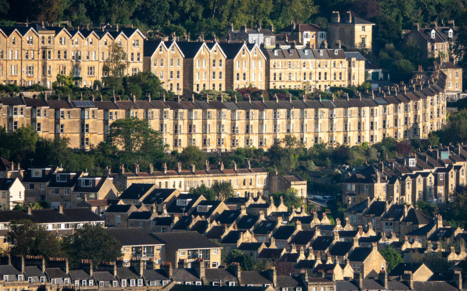 BATH, UNITED KINGDOM - SEPTEMBER 22: The morning light illuminates streets of residential houses and apartments, on September 22, 2023 in Bath, England. According to a report from the Royal Institution of Chartered Surveyors (RICS) soaring interest rates and falling prices will mark the end of the UK’s 13-year housing market boom potentially leading to a house price crash. (Photo by Matt Cardy/Getty Images)