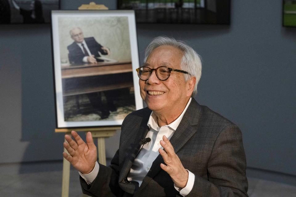 The AP Moscow photo chief, Liu Heung Shing, who was the only foreign photographer who captured Soviet President Mikhail Gorbachev's resignation on Dec. 25, 1991 that marked the end of the USSR, gestures during an interview with the Associated Press at the Shanghai Center of Photography in Shanghai, China on Thursday, Dec. 16, 2021. It was a momentous event that ended an era 30 years ago - Soviet President Mikhail Gorbachev's resignation drawing a line under the USSR's existence. The AP Moscow photo chief, Liu Heung Shing, was the only foreign photographer who captured the final moments of the Soviet Union on Dec. 25, 1991. (AP Photo/Ng Han Guan)